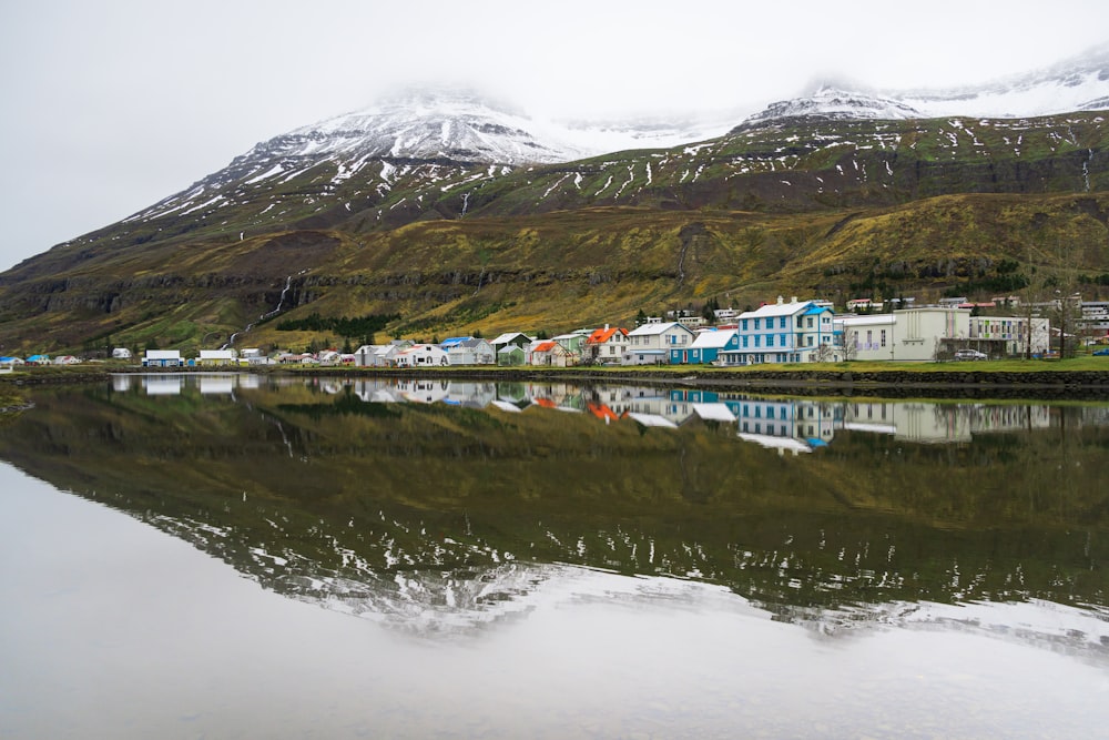 a body of water with a mountain in the background