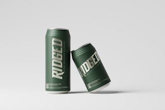 a can of beer sitting next to a can of beer