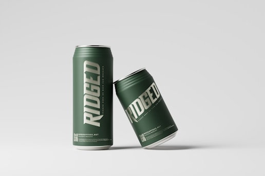 a can of beer sitting next to a can of beer