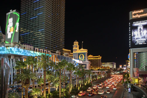 A bustling Las Vegas street with consulting team members discussing plans.