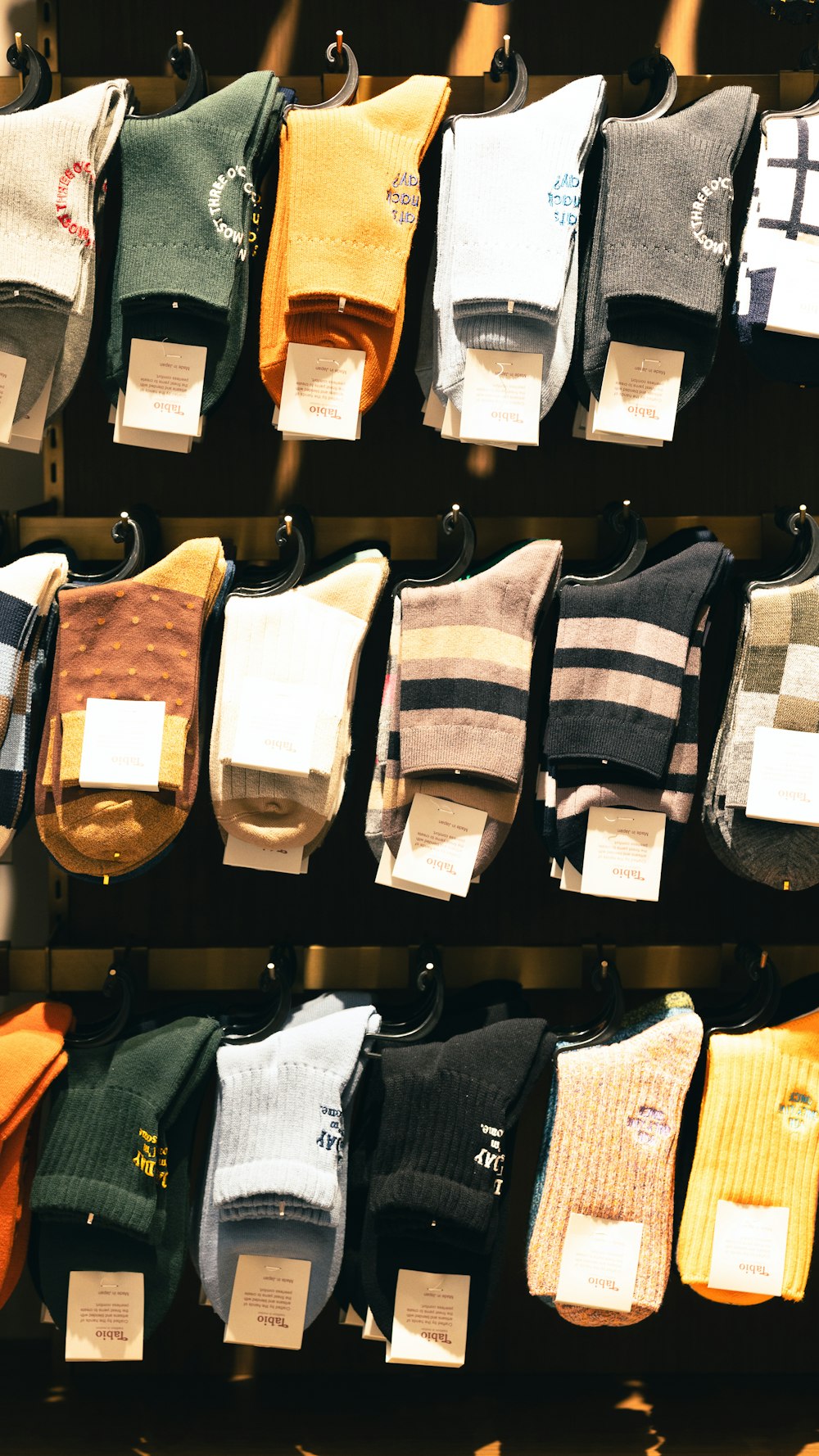 a bunch of socks that are on a rack