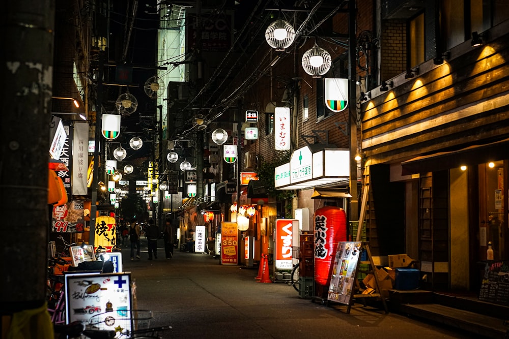 a city street filled with lots of signs and lights