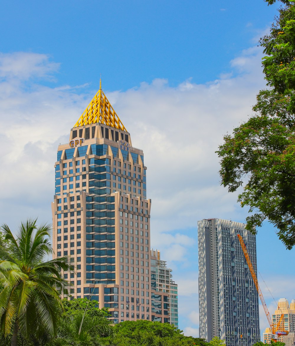 a very tall building with a yellow roof