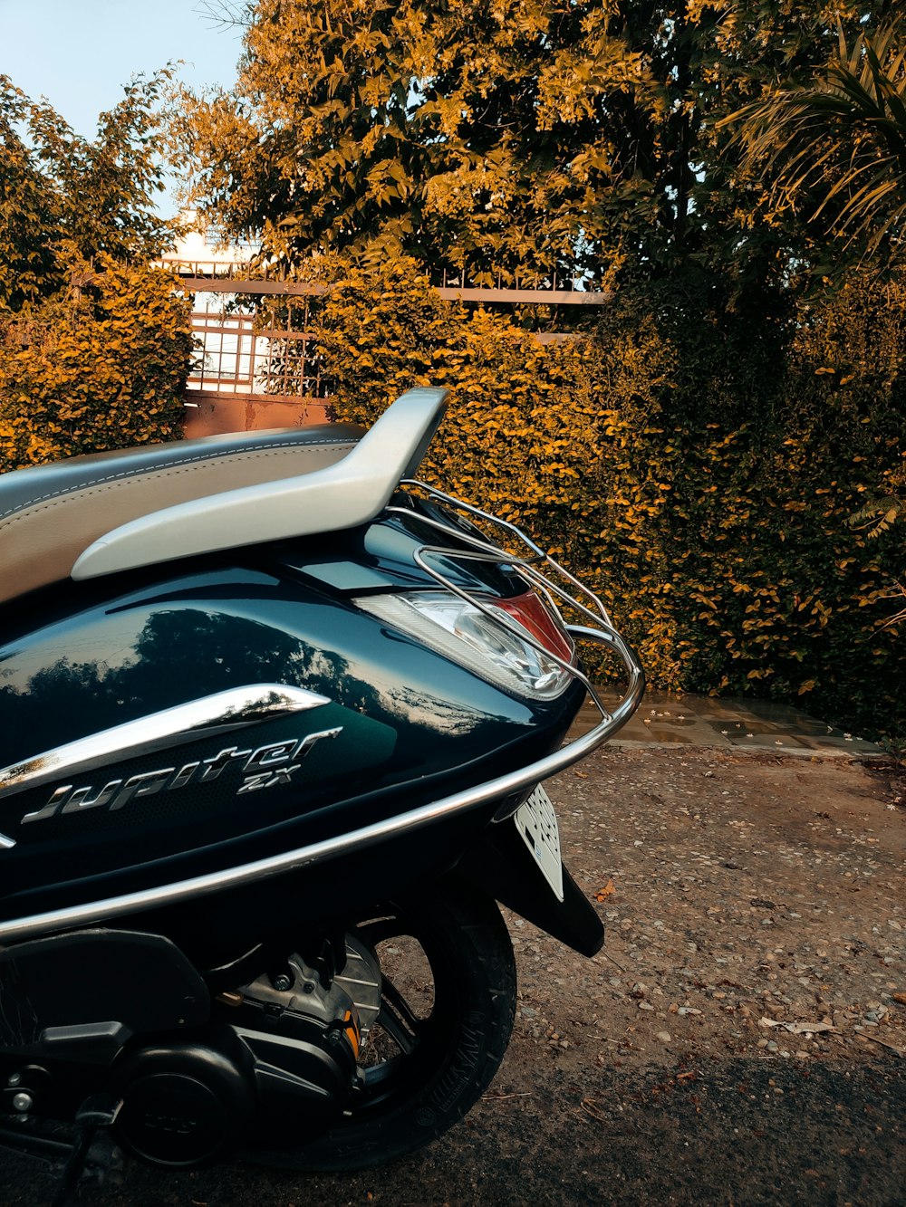 a scooter parked on the side of the road