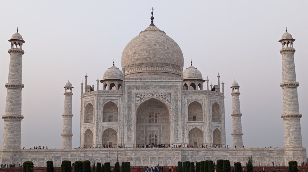 a large white building with two towers and a dome