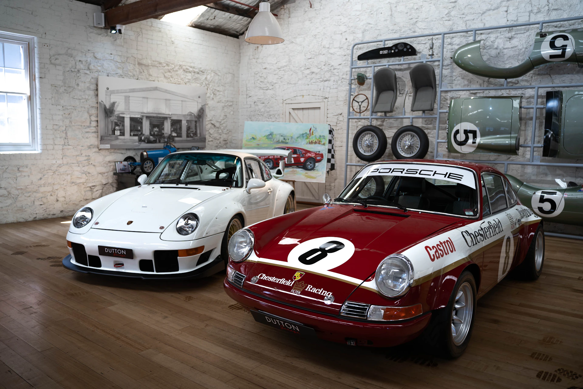 a couple of cars that are on a wooden floor