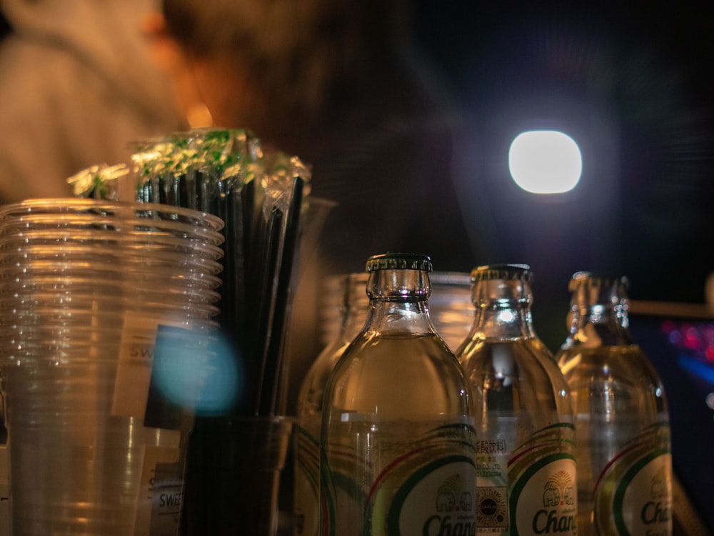 a table topped with lots of bottles of alcohol