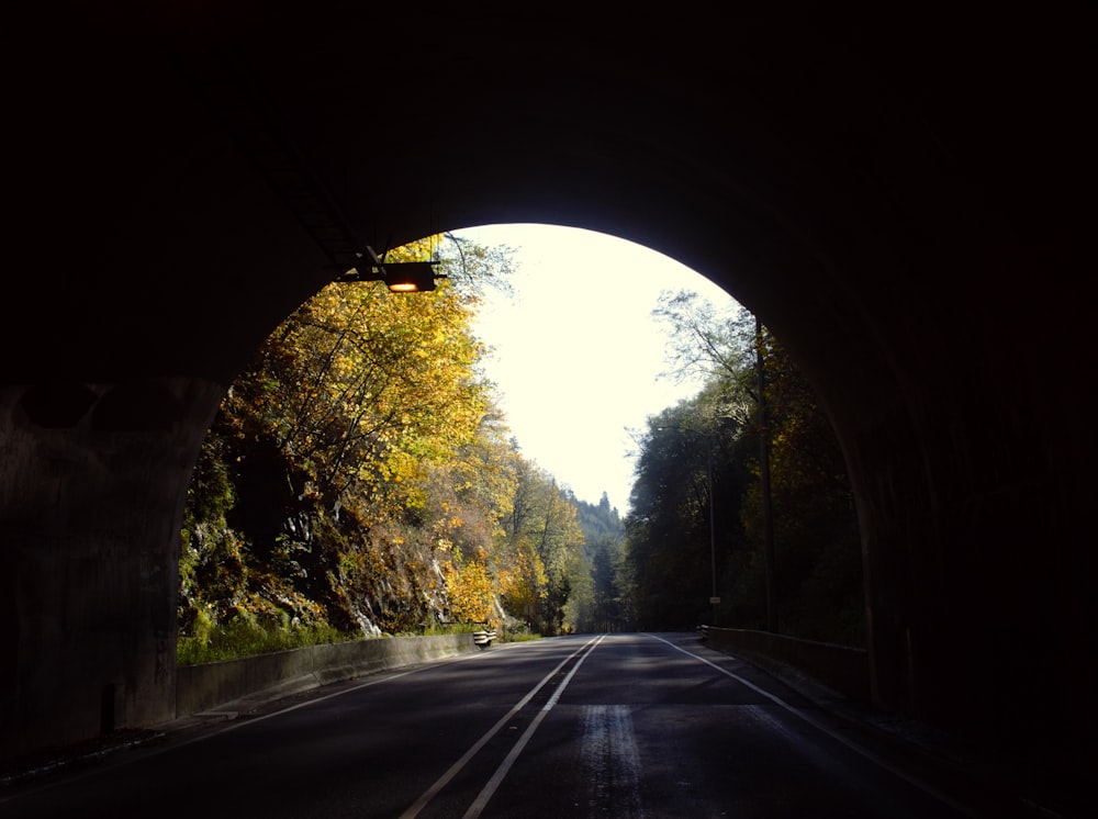 a view of a road through a tunnel