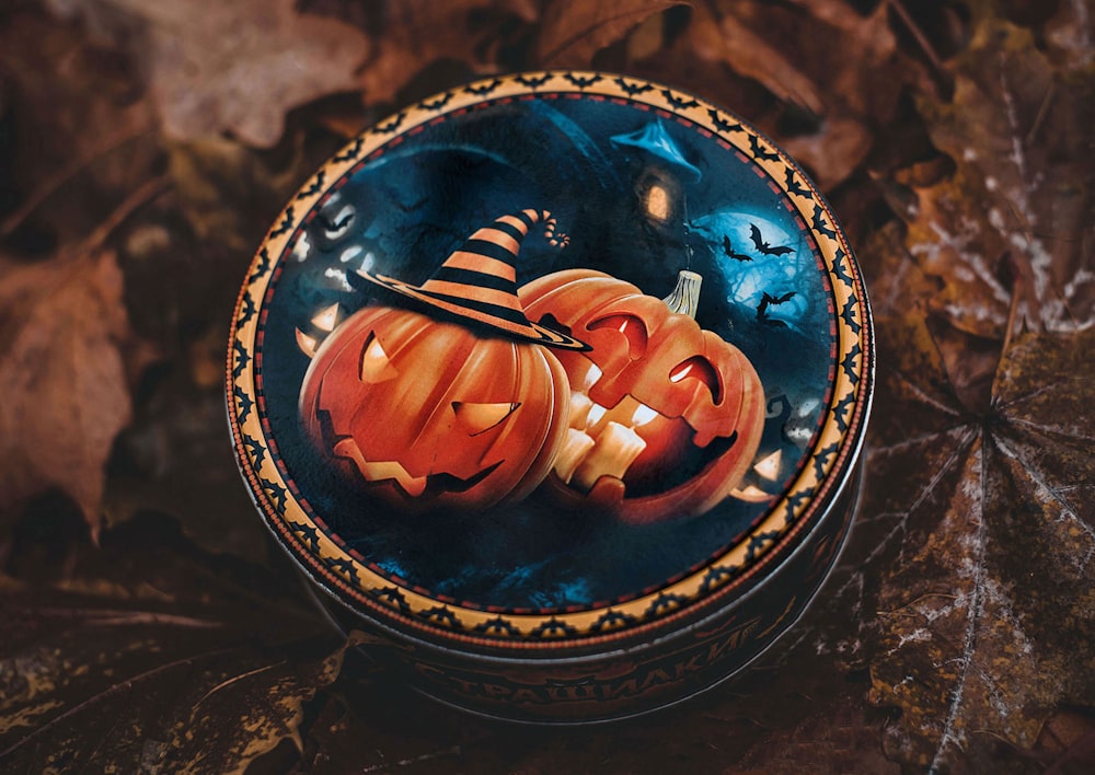 a decorative box with two pumpkins painted on it