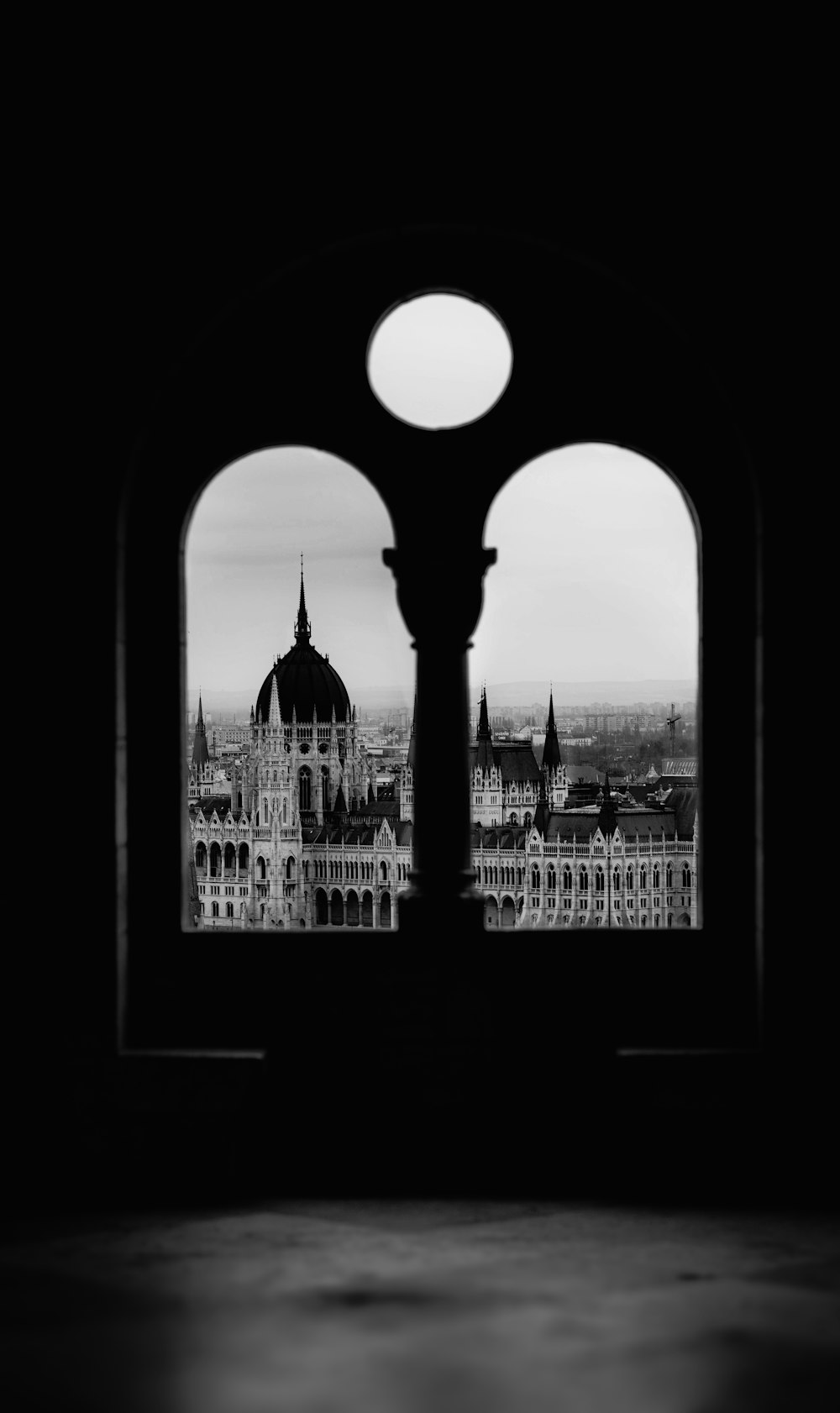 a black and white photo of a clock tower