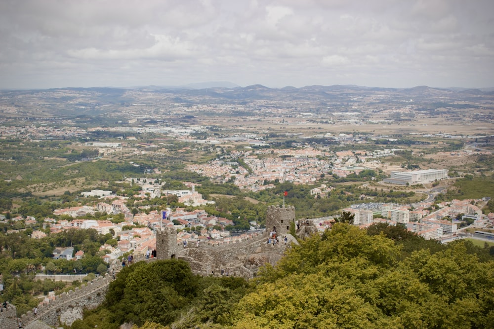 a view of a city from the top of a hill