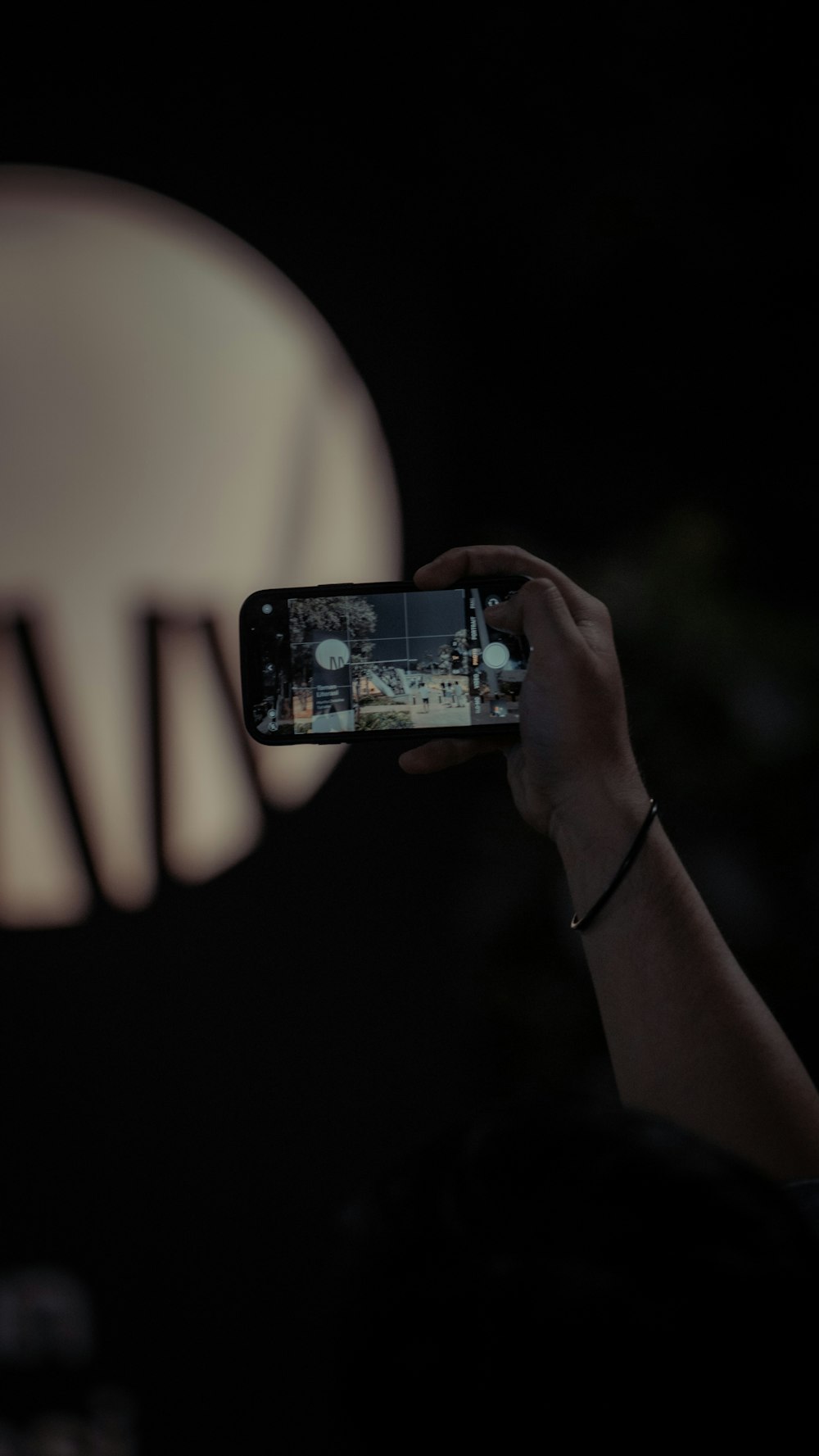 a person taking a picture of a chair with a cell phone