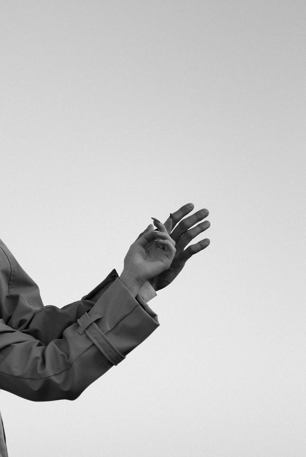 a black and white photo of a man in a suit