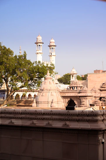 a view of a building with a clock tower in the background