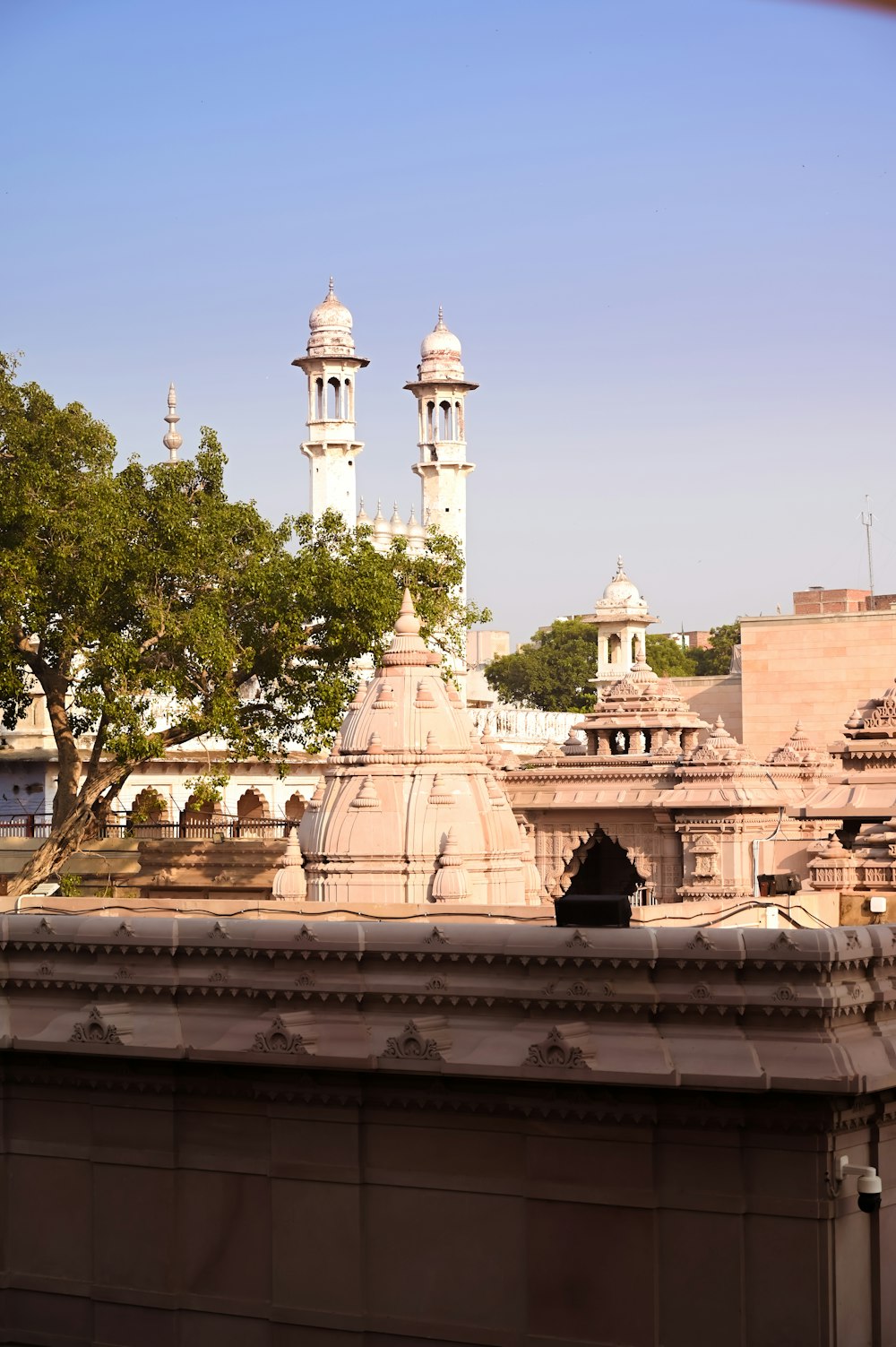 a view of a building with a clock tower in the background