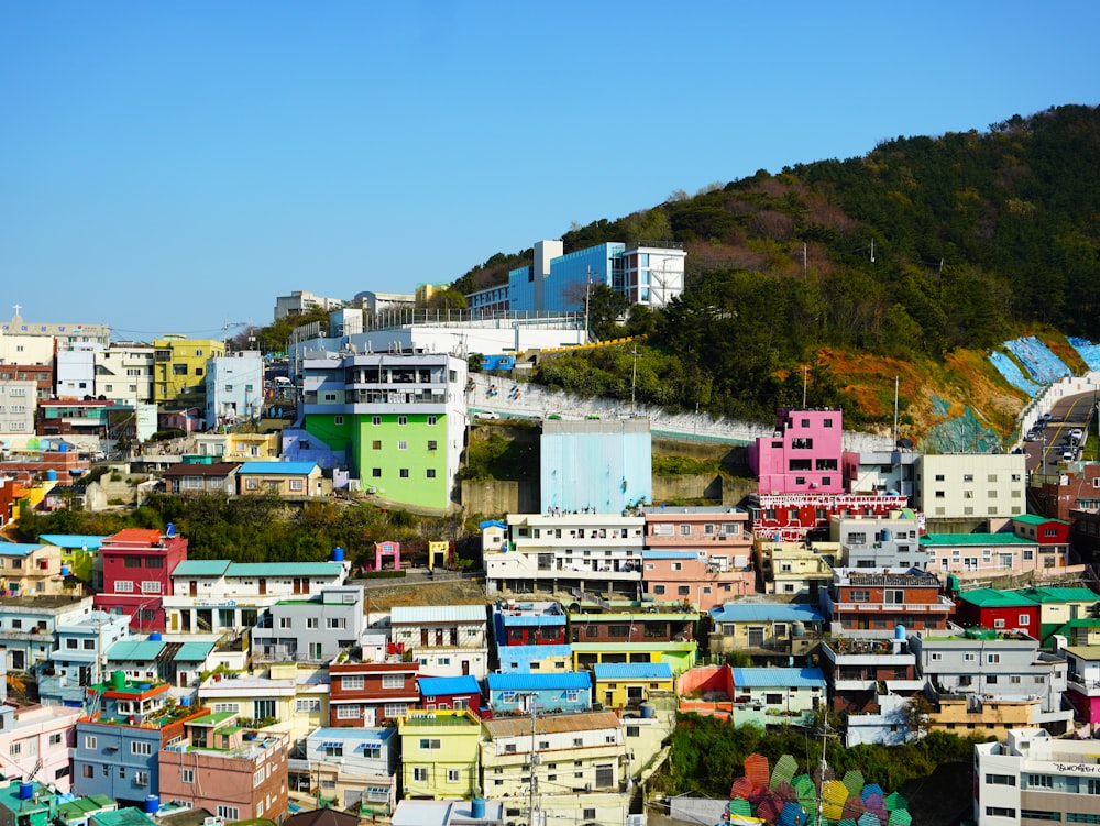 a view of a city with a hill in the background