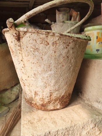 A clean, stainless steel dirty bucket ready for hospital use.