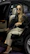 Happy woman stepping out of a sleek taxi with luggage in hand.
