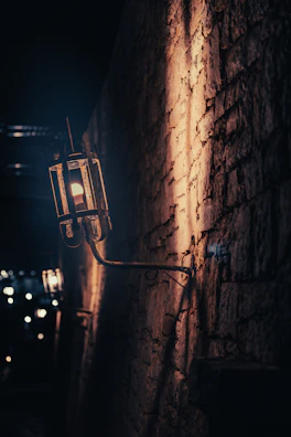 Rustic wrought iron wall sconce casting gentle shadows.