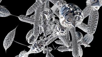 Abstract representation of neural pathways illuminated in subtle silver and black hues.