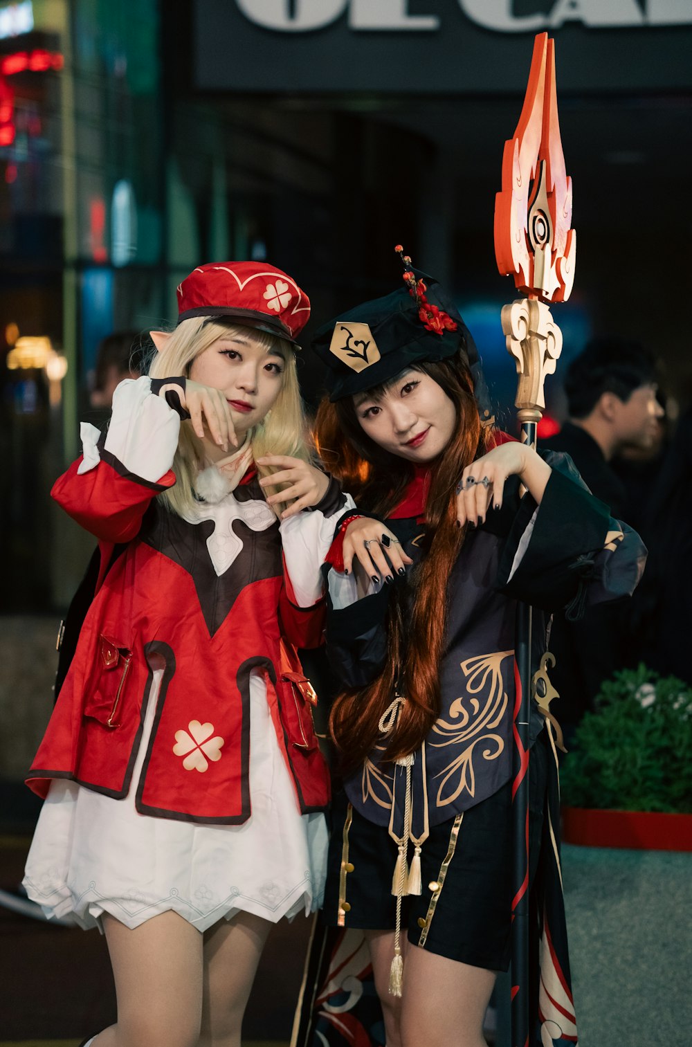 two women dressed in costumes posing for a picture