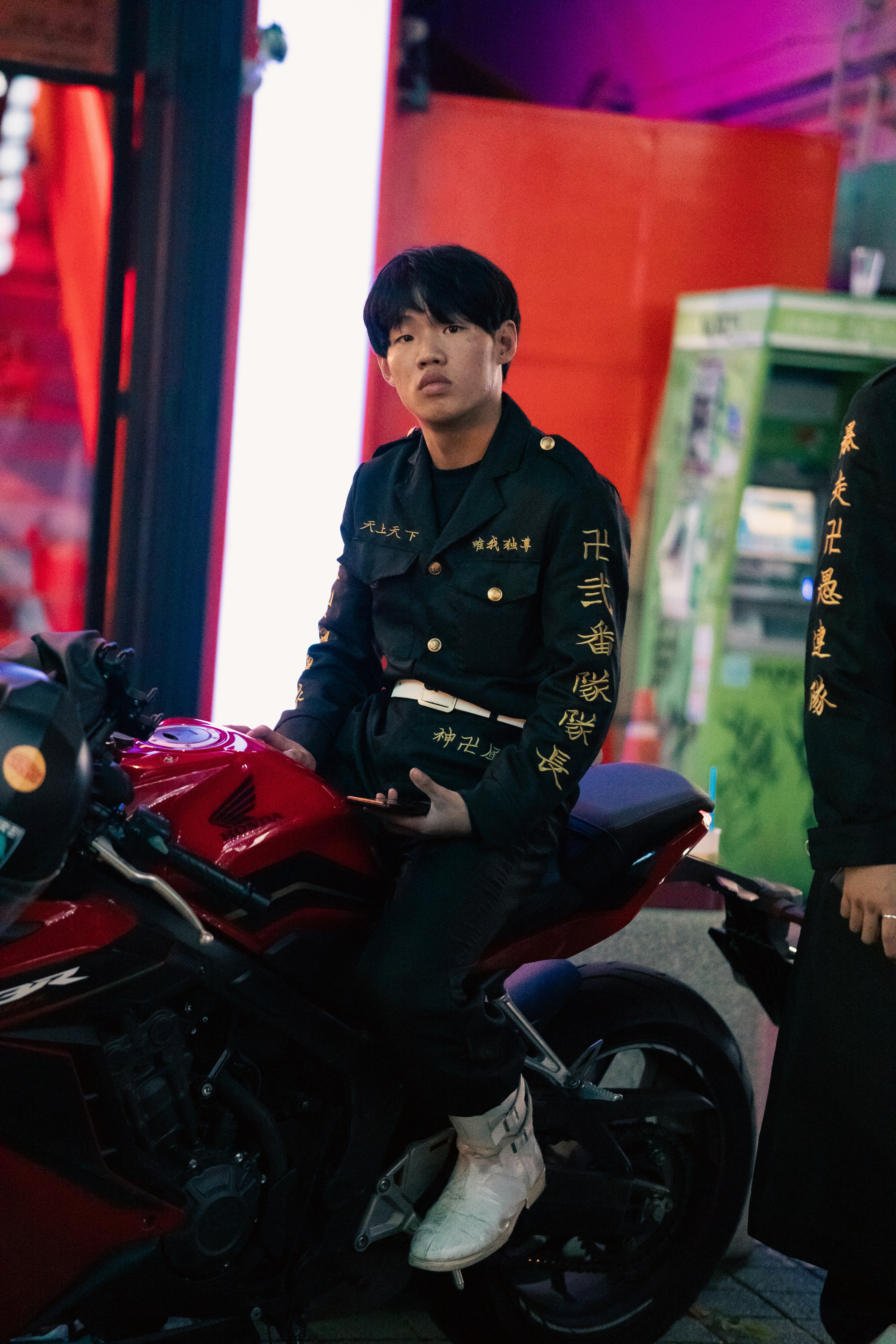 a man in uniform sitting on a motorcycle