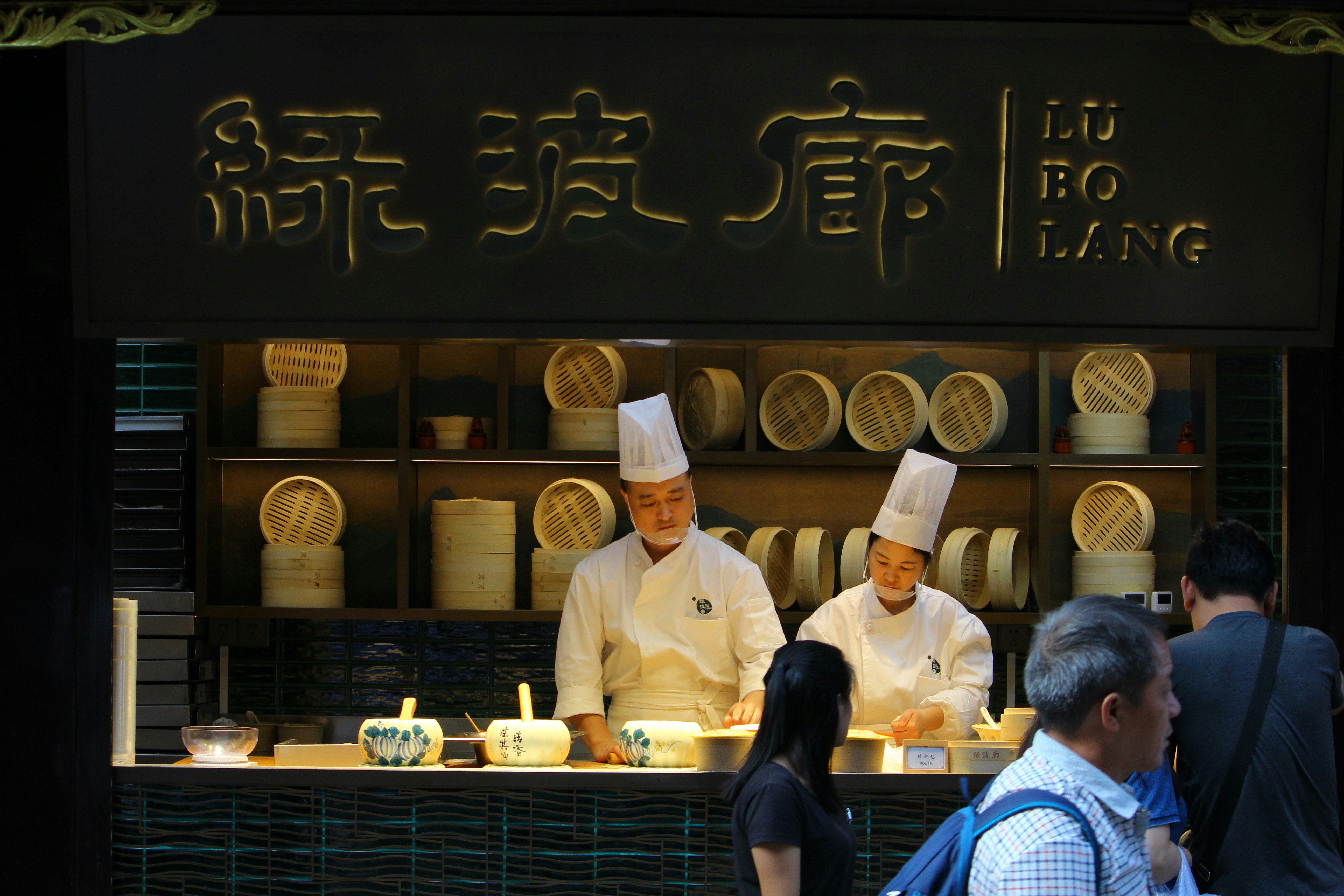 a group of people standing in front of a counter
