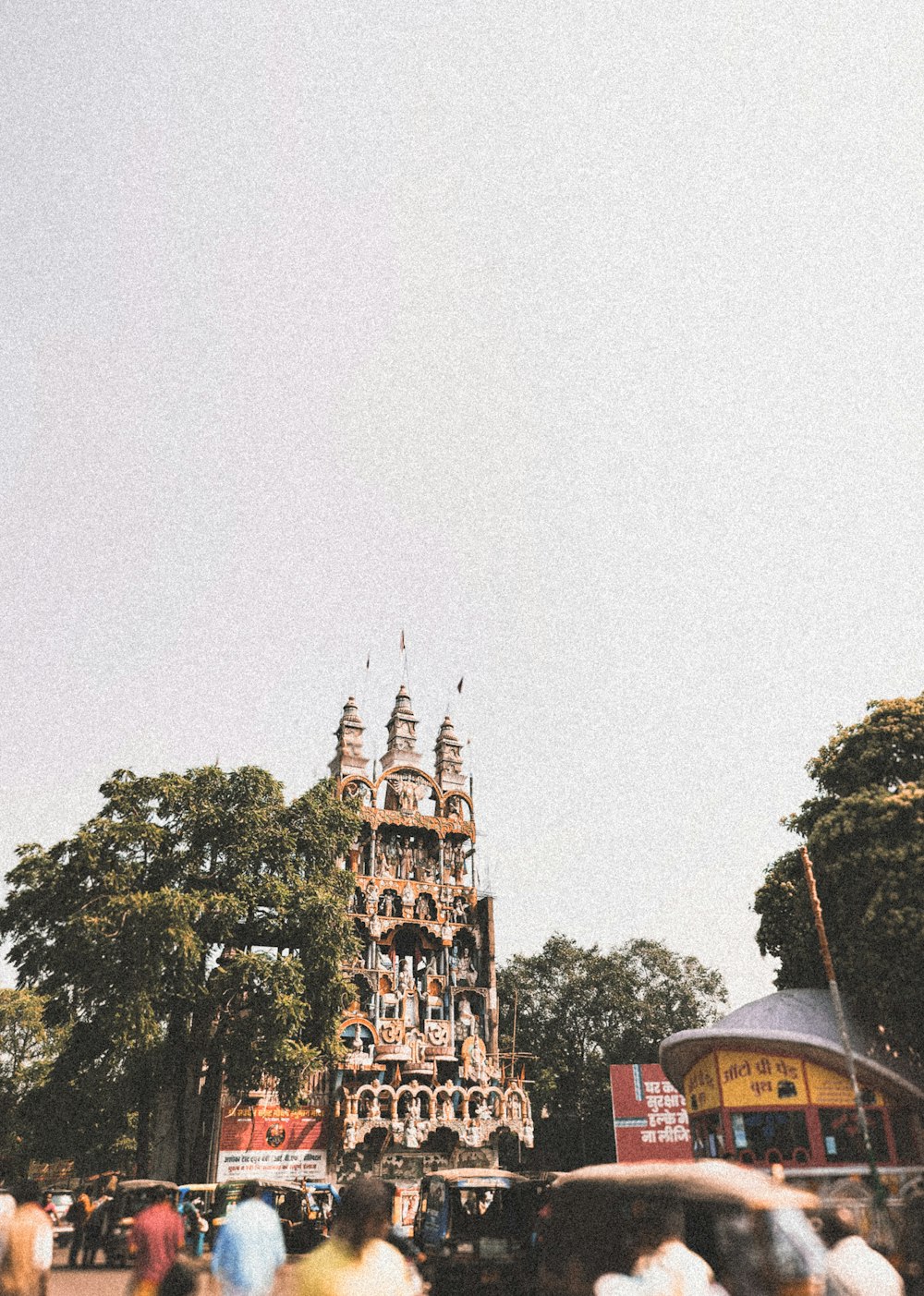 a tall tower with many spires on top of it