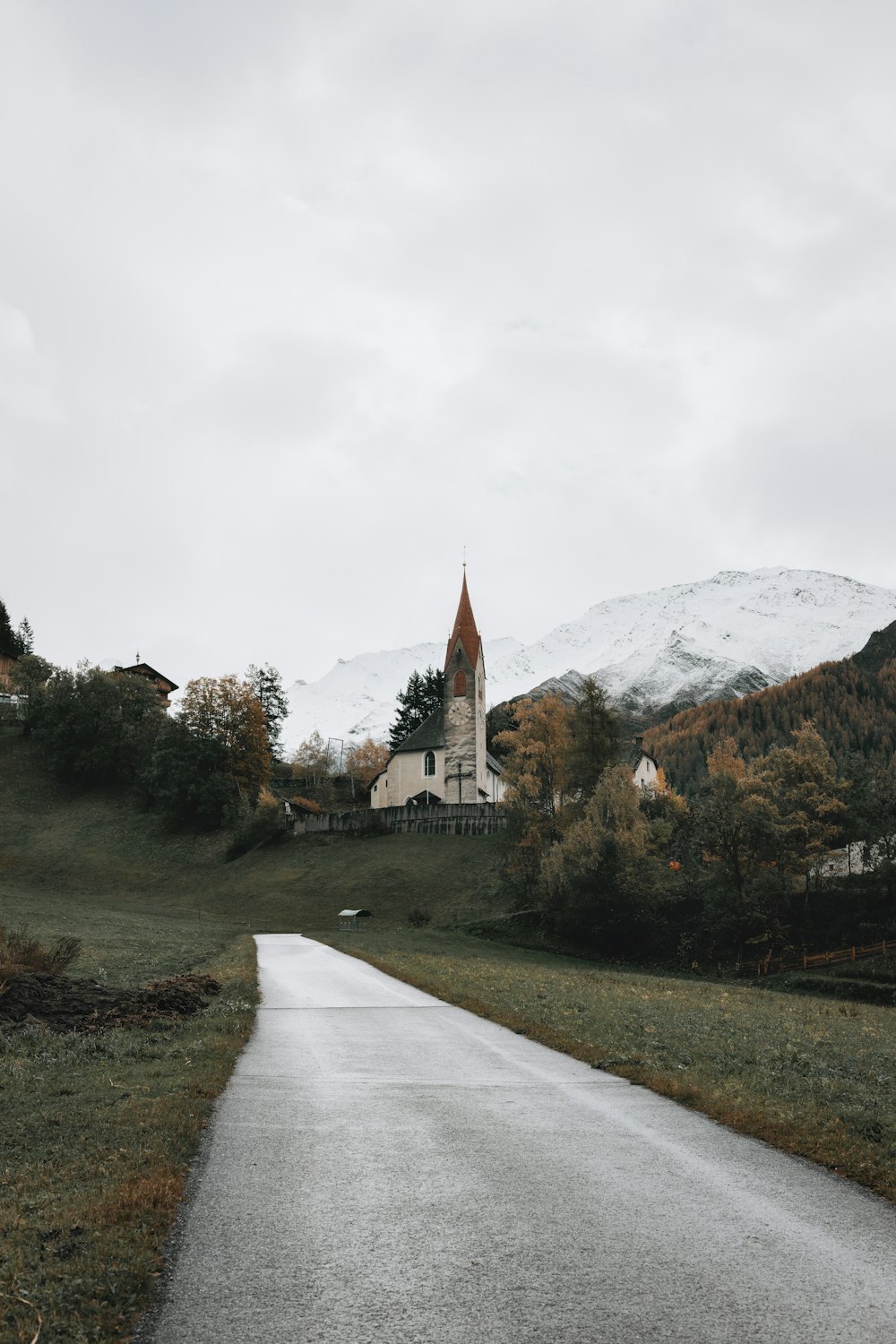 a church in the middle of a rural road