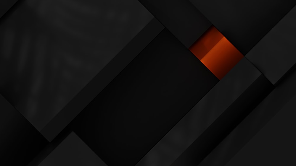 a black and orange wallpaper with squares