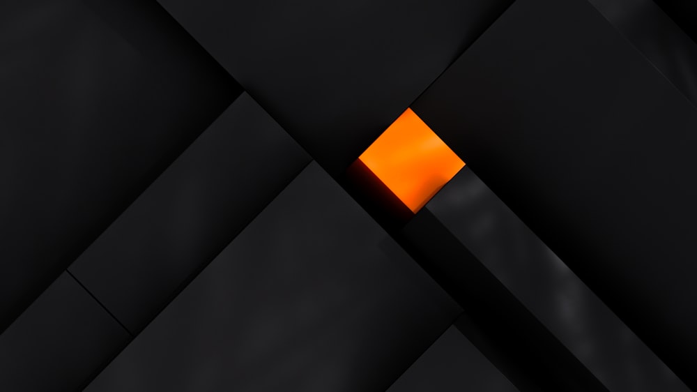 a black and orange background with a square in the center