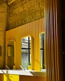 Mirror surface polished to a clear, streak-free shine in a modern bathroom.