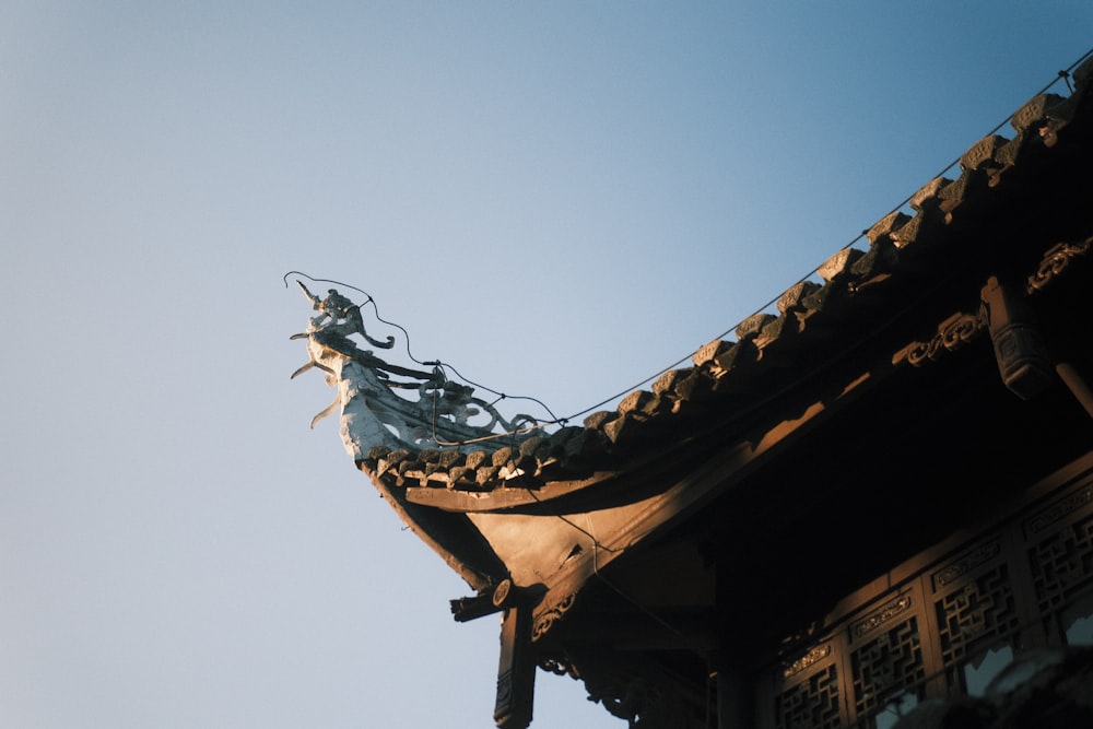 the roof of a building with a dragon on it