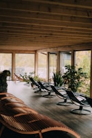 A peaceful waiting area with natural wood furniture and plants creating a calming atmosphere.