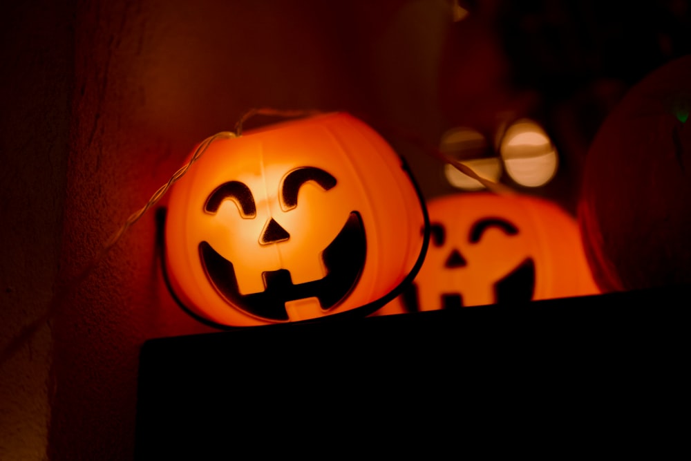 a couple of pumpkins sitting on top of a table