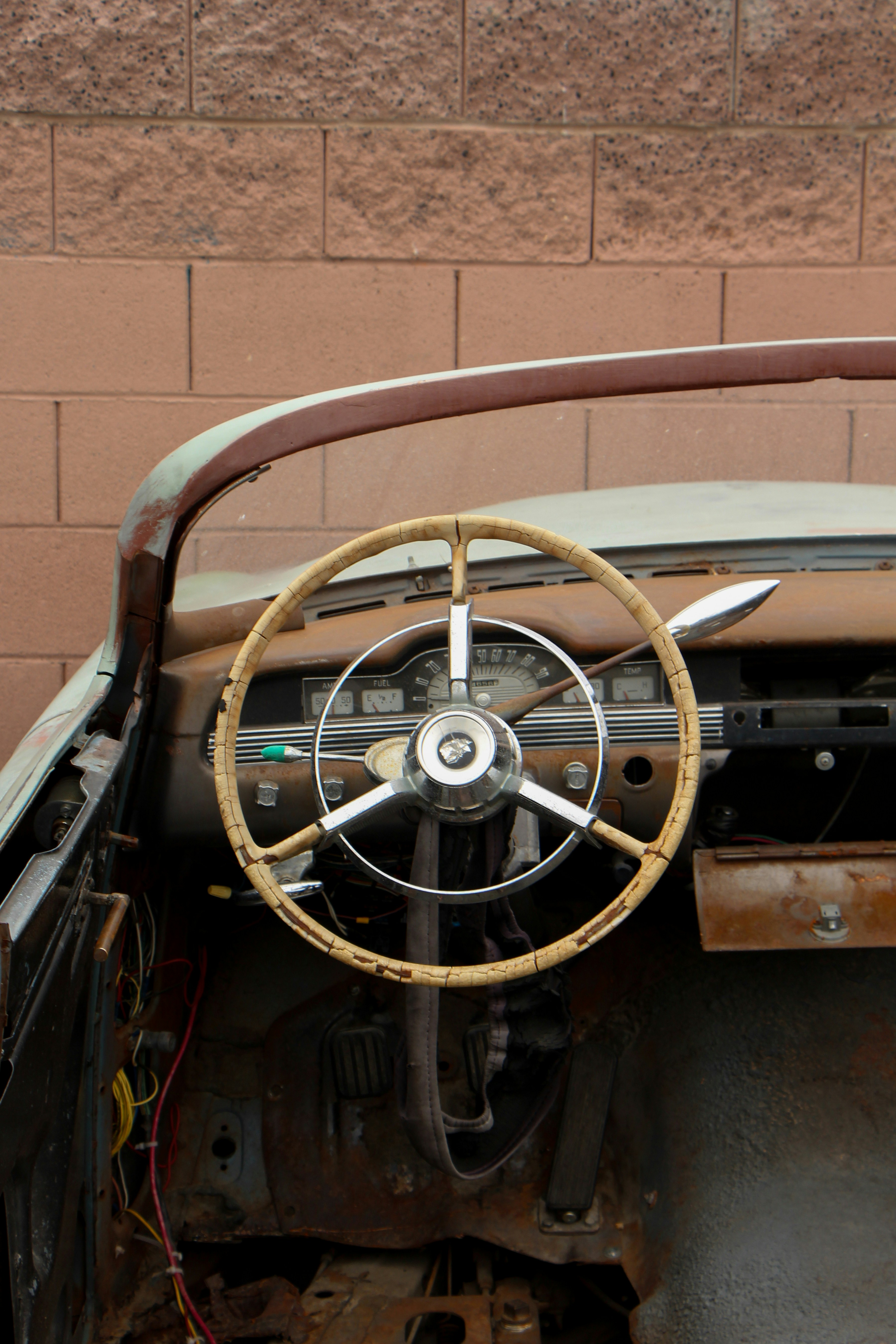 the interior of an old car with a steering wheel