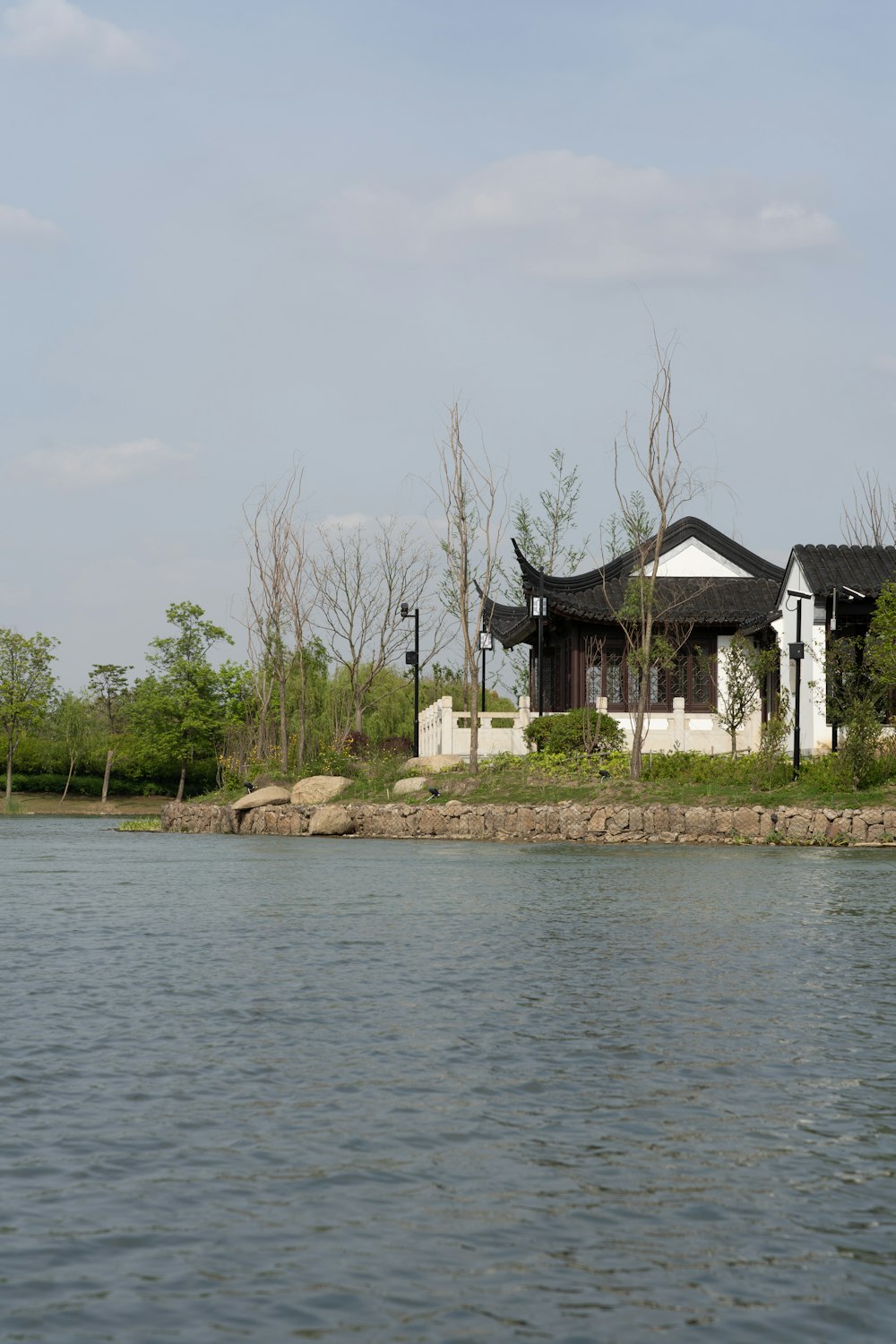 a house on a small island in the middle of a lake