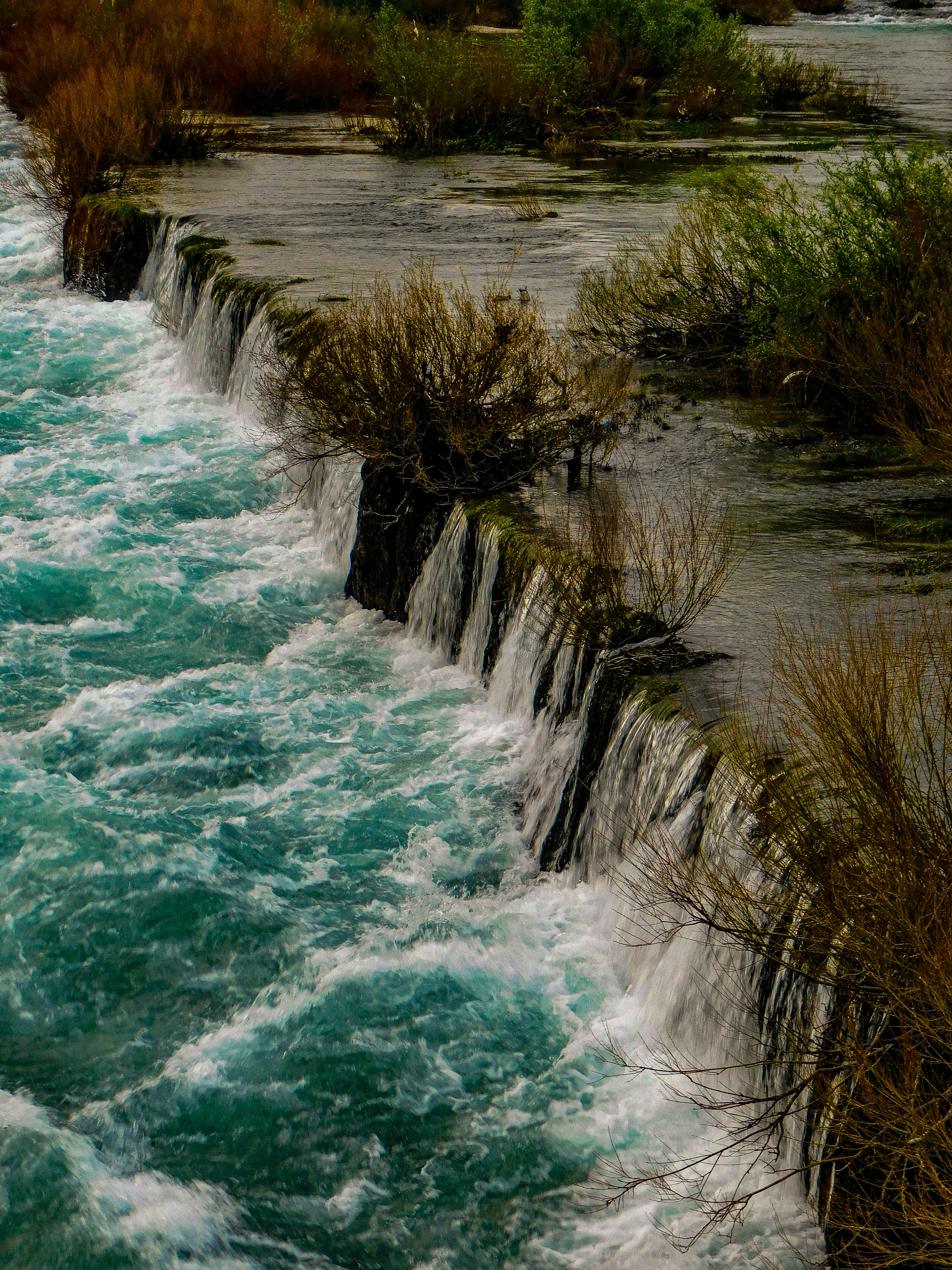 The water is rushing down the side of the cliff photo – Free Bunski ...