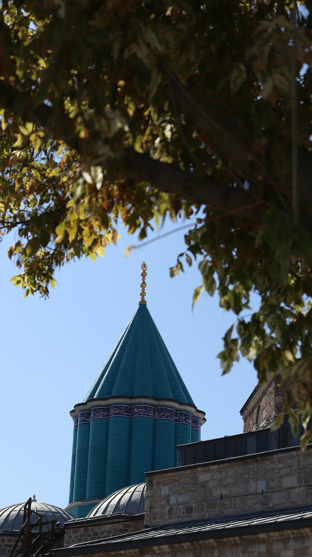 a tall building with a blue dome on top of it