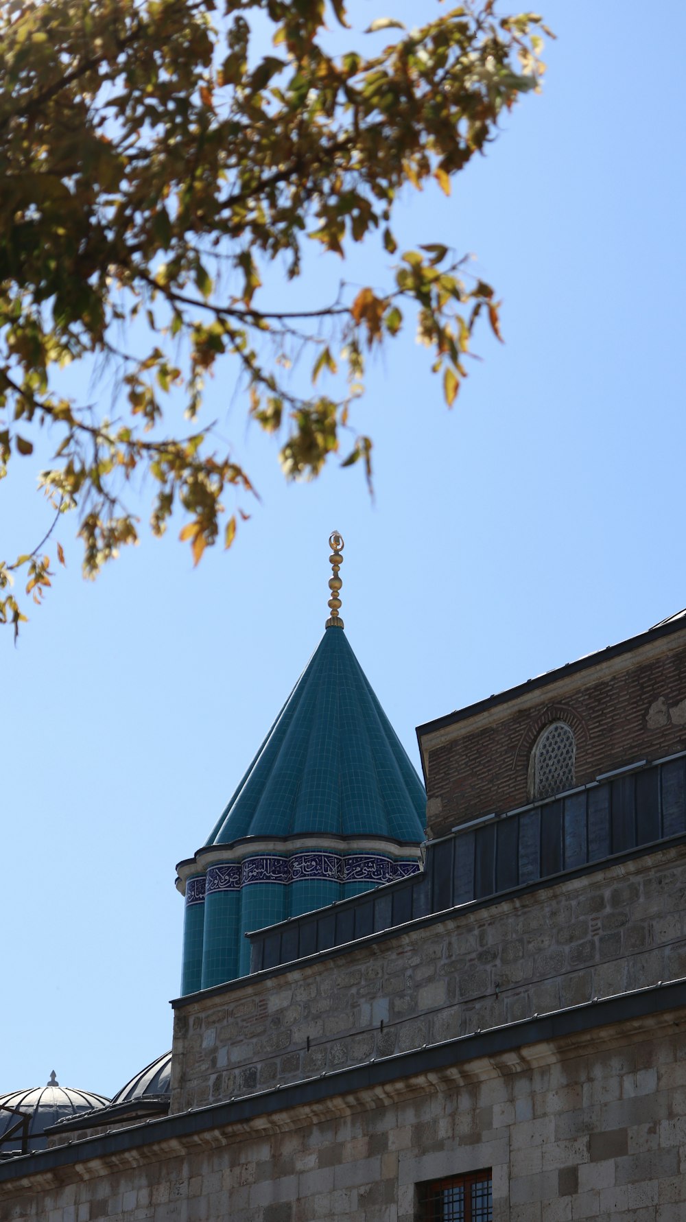 a tall building with a blue dome on top of it