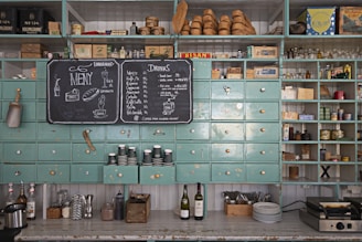 a kitchen with a chalk board and a chalk board on the wall