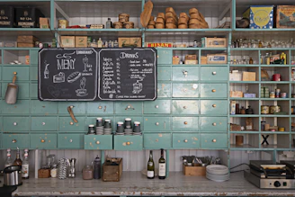 a kitchen with a chalk board and a chalk board on the wall