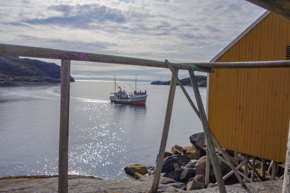 a boat is out on the water near a dock