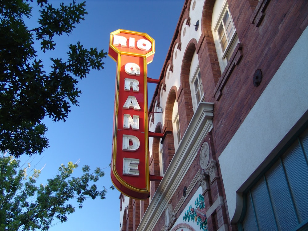 a large neon sign on the side of a building