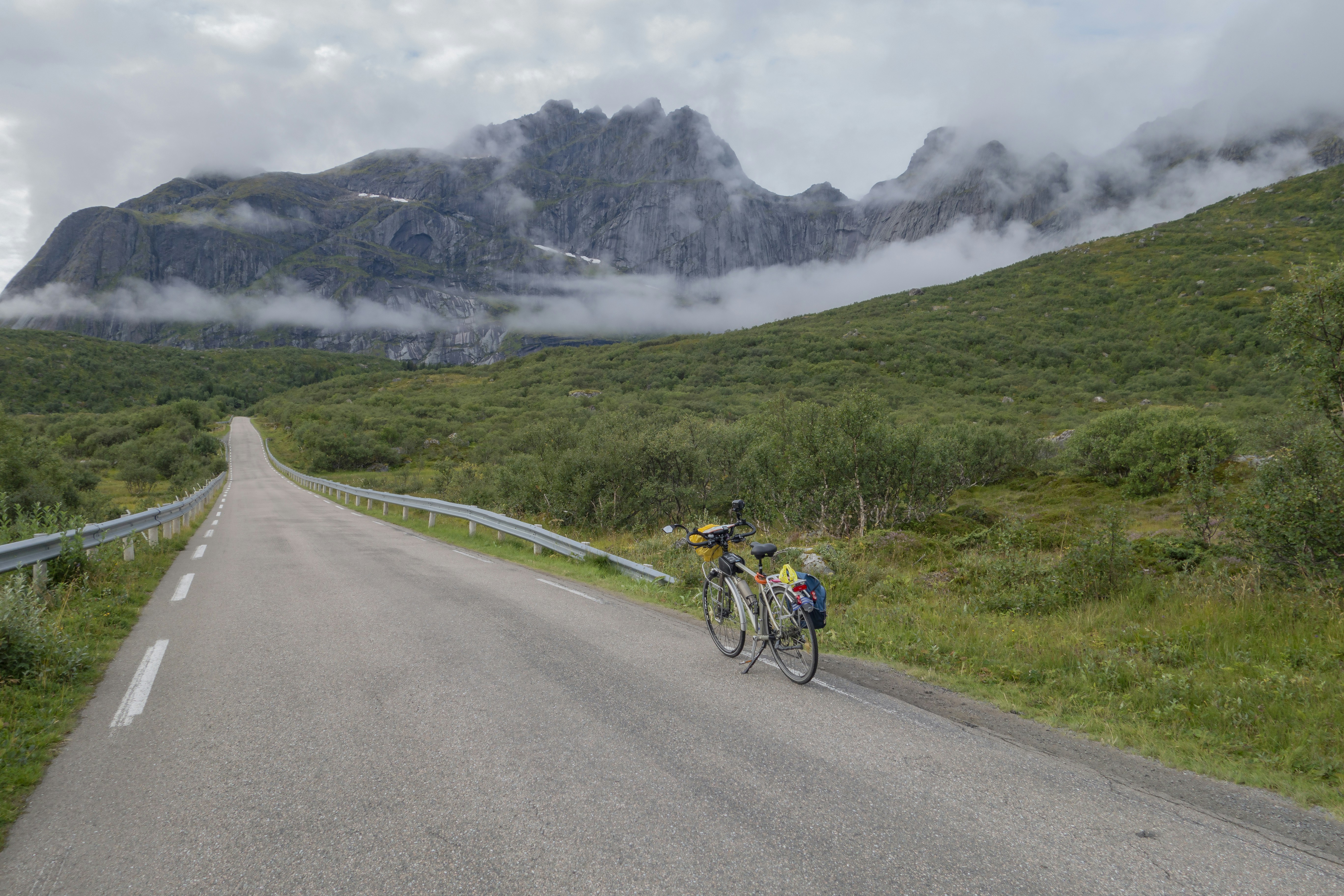 a bicycle parked on the side of a road