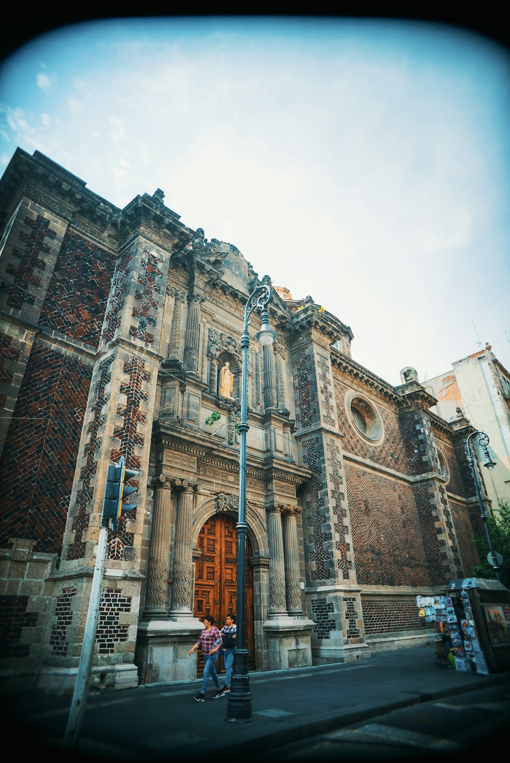 a couple of people that are standing in front of a building