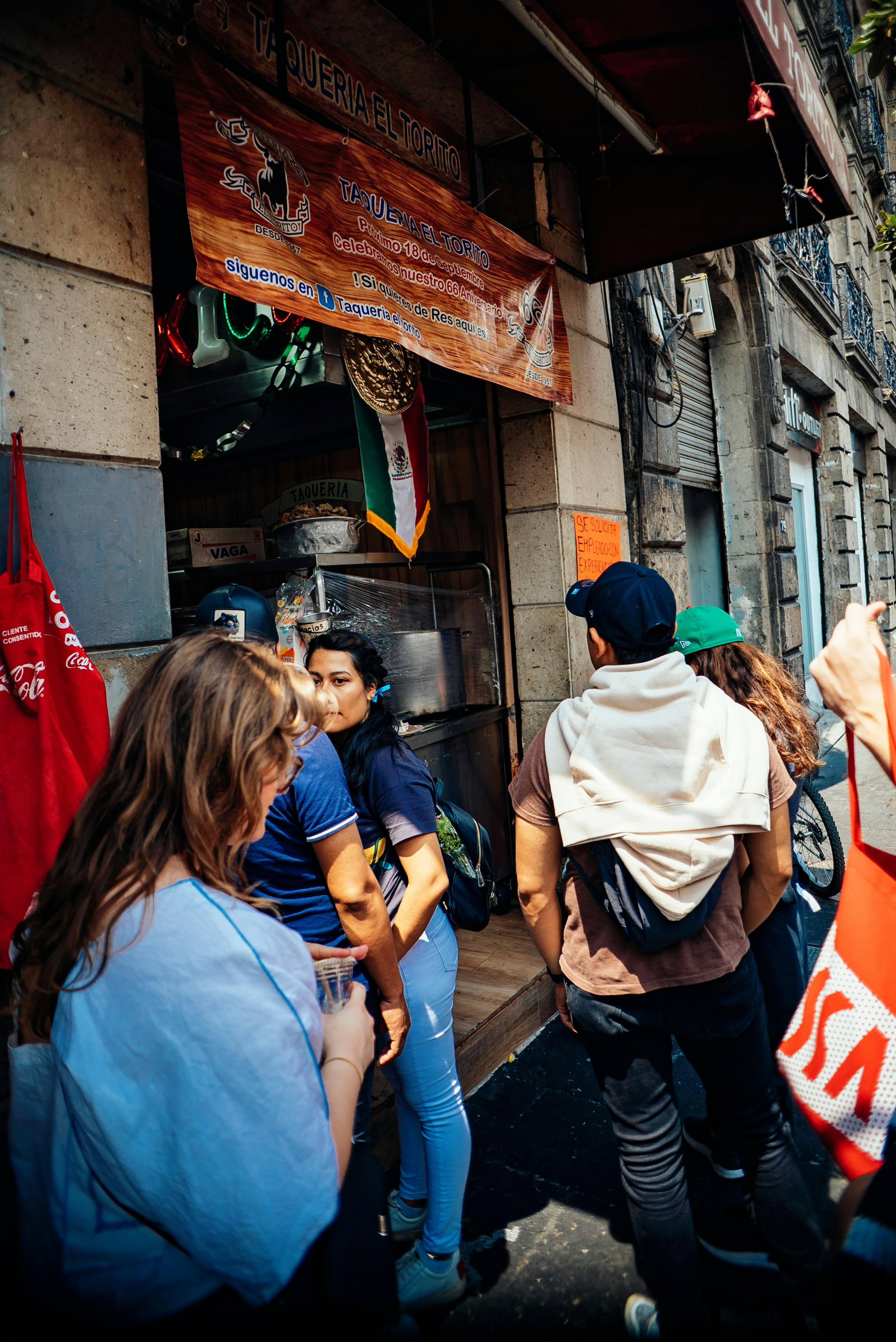 a group of people standing outside of a building