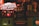 A dimly lit bar or pub interior with various vintage-style beer and liquor advertisements on wooden crates. Prominent brands like Desperados and Voll-Damm are visible, along with other labels. A no-smoking sign is displayed as well. The overall setting is rustic and nostalgic.