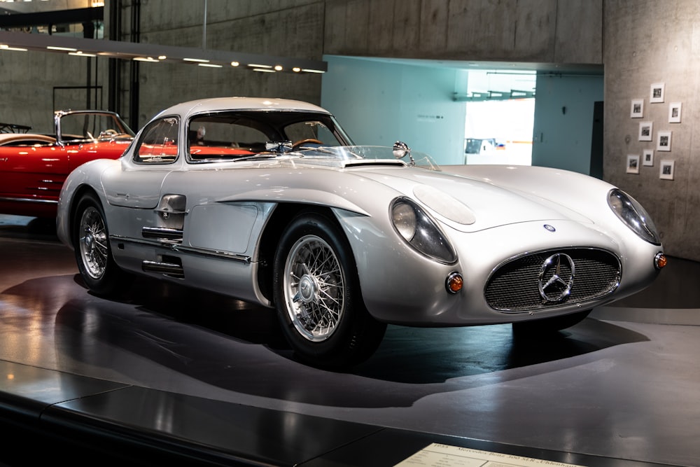 a mercedes sports car on display in a museum