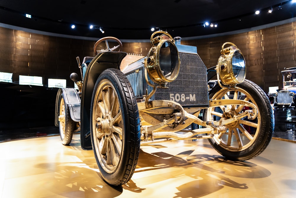 an antique car on display in a museum